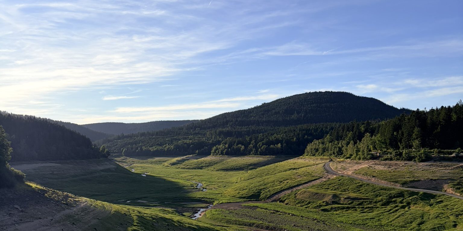 View from the wall of the Schwarzenbach Dam across the valley and the wooded hills of the Black Forest